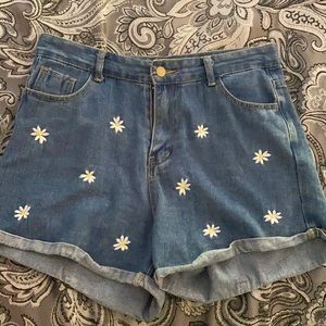 Slightly used jean shorts with daisys. From SHEIN